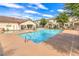 Community pool area with lounge chairs and clear, refreshing water at 5330 E Charleston Blvd # 28, Las Vegas, NV 89142