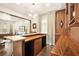 Stylish home bar featuring custom wood accents, modern lighting, and comfortable seating at 5850 Rockway Glen Ave, Las Vegas, NV 89141