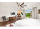 Bright bedroom features a large window, modern decor, and wood-look floors, creating a serene space at 5850 Rockway Glen Ave, Las Vegas, NV 89141