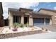 Charming single-story home with a well-maintained xeriscaped front yard and a two car garage at 5850 Rockway Glen Ave, Las Vegas, NV 89141