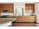Kitchen boasts modern cabinetry, stainless steel appliances, and granite countertops at 5850 Rockway Glen Ave, Las Vegas, NV 89141