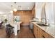 A clean kitchen view with a large island, modern lighting, and high-end stainless appliances at 5850 Rockway Glen Ave, Las Vegas, NV 89141