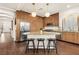 Modern kitchen featuring custom wood cabinets, stainless steel appliances, and granite countertops at 5850 Rockway Glen Ave, Las Vegas, NV 89141