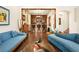 Cozy living room with a wooden bar, modern furniture, and hardwood floors at 5850 Rockway Glen Ave, Las Vegas, NV 89141