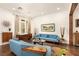 Sun-lit living room boasts hardwood floors, recessed lighting, a picturesque window, and tasteful decor at 5850 Rockway Glen Ave, Las Vegas, NV 89141