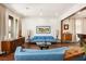 Bright living room with modern furnishings, hardwood floors, and a large window with natural light at 5850 Rockway Glen Ave, Las Vegas, NV 89141