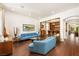 Spacious living room boasts an open layout, hardwood floors, recessed lighting, and a stylish bar at 5850 Rockway Glen Ave, Las Vegas, NV 89141