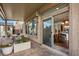 Covered patio with outdoor dining and sliding door access to the indoor dining area at 5850 Rockway Glen Ave, Las Vegas, NV 89141