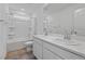 Modern bathroom features double sinks, a shower-tub combo, and tiled floors at 5937 W Frias Ave, Las Vegas, NV 89141