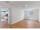 Spacious bedroom featuring wood floors, a closet, and a bright window at 5937 W Frias Ave, Las Vegas, NV 89141