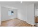 Bright bedroom featuring wood floors and a window with natural light at 5937 W Frias Ave, Las Vegas, NV 89141