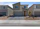 Charming two-story home featuring desert landscaping, brick paved driveway, and an attached two car garage at 5937 W Frias Ave, Las Vegas, NV 89141
