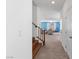 Hallway view leading into living room area, also features a staircase with wood-look steps at 5937 W Frias Ave, Las Vegas, NV 89141