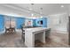 Bright open-concept living space which connects the dining area, living room, and kitchen at 5937 W Frias Ave, Las Vegas, NV 89141