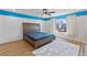 Stylish main bedroom featuring a bed, area rug, and a bright window at 5937 W Frias Ave, Las Vegas, NV 89141