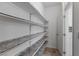View of pantry showcasing lots of shelves for storage and ceramic tile flooring at 5937 W Frias Ave, Las Vegas, NV 89141