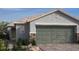 Charming single-story home featuring a neutral color scheme, desert landscaping and a two-car garage at 5941 Violet Crown St, North Las Vegas, NV 89081