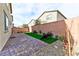 Low-maintenance backyard with brick patio, turf and gravel, offering a serene outdoor area at 6046 Castle Gardens Ave, Las Vegas, NV 89130