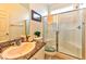 Bright bathroom featuring granite countertop, a toilet, and enclosed glass shower with seat at 6046 Castle Gardens Ave, Las Vegas, NV 89130