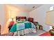 Bright bedroom with a comfortable bed, side table, and a lamp offering a relaxing atmosphere at 6046 Castle Gardens Ave, Las Vegas, NV 89130