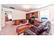 Spacious bonus room with sofa, desk, and built-in shelving at 6046 Castle Gardens Ave, Las Vegas, NV 89130