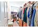 Organized walk-in closet featuring ample hanging space and shelves for storage solutions at 6046 Castle Gardens Ave, Las Vegas, NV 89130