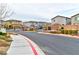 Gated community entrance featuring well-maintained landscaping and access to modern homes at 6046 Castle Gardens Ave, Las Vegas, NV 89130
