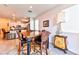 Dining area with wood table and chairs next to modern kitchen at 6046 Castle Gardens Ave, Las Vegas, NV 89130