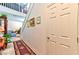 Hallway featuring tiled floors, staircase, and access to the living area at 6046 Castle Gardens Ave, Las Vegas, NV 89130