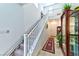 Hallway featuring staircase chair lift, tiled floors, and staircase at 6046 Castle Gardens Ave, Las Vegas, NV 89130