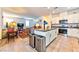 Open kitchen layout with island seating and seamless transition to the living area at 6046 Castle Gardens Ave, Las Vegas, NV 89130