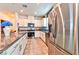 Modern kitchen featuring stainless steel appliances and granite countertops at 6046 Castle Gardens Ave, Las Vegas, NV 89130