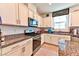 Well-equipped kitchen with granite countertops and modern stainless appliances at 6046 Castle Gardens Ave, Las Vegas, NV 89130
