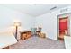 Versatile room with carpet, storage boxes, and views into an adjacent bathroom at 6046 Castle Gardens Ave, Las Vegas, NV 89130