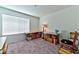 Neutral room with carpet, a large window, and two tables with storage boxes underneath at 6046 Castle Gardens Ave, Las Vegas, NV 89130