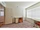 Neutral room with carpet, storage boxes, and view of the upstairs landing at 6046 Castle Gardens Ave, Las Vegas, NV 89130