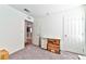 Empty room features storage boxes and a hallway leading to the rest of the house at 6046 Castle Gardens Ave, Las Vegas, NV 89130