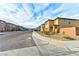 Neighborhood street view showcasing well-maintained homes and landscaped front yards at 6046 Castle Gardens Ave, Las Vegas, NV 89130