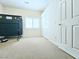 Bright bedroom with neutral carpet, white walls, shuttered window, and closet with folding doors at 6269 Bold Regatta Ct, Las Vegas, NV 89139