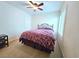 Cozy bedroom with a bed, window with plantation shutters, and ceiling fan at 6269 Bold Regatta Ct, Las Vegas, NV 89139