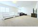 Bright bonus room with carpet, plantation shutters, and furnishings including a brown leather sofa at 6269 Bold Regatta Ct, Las Vegas, NV 89139