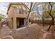 Spacious backyard with patio, decorative brick borders, and low-maintenance desert landscaping at 6279 Dollar Bill Ct, Las Vegas, NV 89141