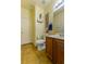 Well-maintained bathroom with vanity, toilet, and decorative shelving at 6279 Dollar Bill Ct, Las Vegas, NV 89141