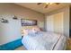 Neutral bedroom with ceiling fan, carpeted floor, and ample natural light at 6279 Dollar Bill Ct, Las Vegas, NV 89141