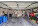 Spacious two-car garage with ample storage shelves and various household items at 6279 Dollar Bill Ct, Las Vegas, NV 89141