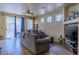 Spacious living room with tile flooring and sliding glass door leading to the yard at 6279 Dollar Bill Ct, Las Vegas, NV 89141