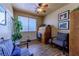 Cozy office space featuring wood floors, natural light, and comfortable seating at 6279 Dollar Bill Ct, Las Vegas, NV 89141