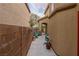 Side walkway with block wall, concrete, and a gate leading to the backyard at 6279 Dollar Bill Ct, Las Vegas, NV 89141