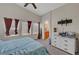 Bright bedroom with ample natural light streaming through multiple windows at 6433 Buck Jones Ave # 102, Las Vegas, NV 89122