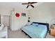 Cozy bedroom with a ceiling fan, carpet flooring, and closet for ample storage at 6433 Buck Jones Ave # 102, Las Vegas, NV 89122